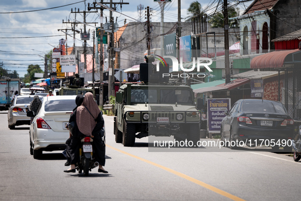 Soldiers in an APC patrol Tak Bai town. Daily life in Tak Bai, Narathiwat, Thailand, on October 25, 2024. Tak Bai is the site of an incident...