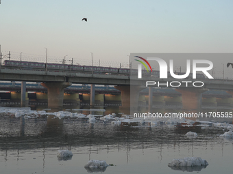 Toxic frothing is seen in the Yamuna River at Kalindi Kunj in New Delhi, India, on October 25, 2024. (