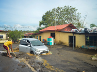 Residents in Lemery, Batangas, were seen cleaning up mud and debris on October 25, 2024, after Tropical Storm Kristine caused severe floodin...