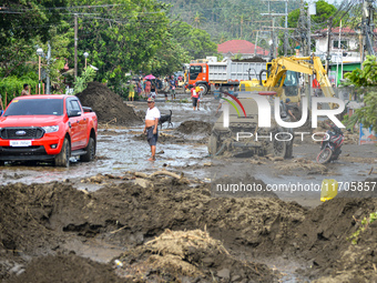 Residents in Lemery, Batangas, were seen cleaning up mud and debris on October 25, 2024, after Tropical Storm Kristine caused severe floodin...