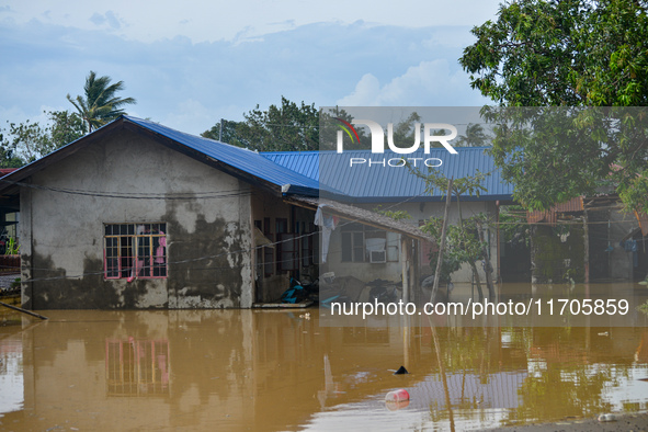 Residents in Lemery, Batangas, were seen cleaning up mud and debris on October 25, 2024, after Tropical Storm Kristine caused severe floodin...