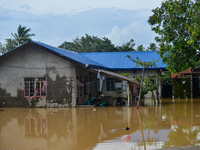 Residents in Lemery, Batangas, were seen cleaning up mud and debris on October 25, 2024, after Tropical Storm Kristine caused severe floodin...