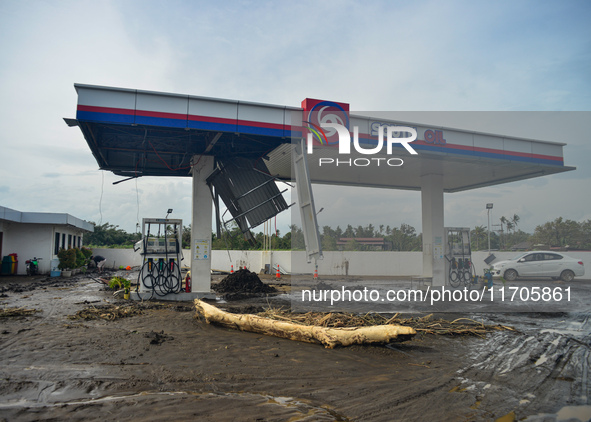 Residents in Lemery, Batangas, were seen cleaning up mud and debris on October 25, 2024, after Tropical Storm Kristine caused severe floodin...