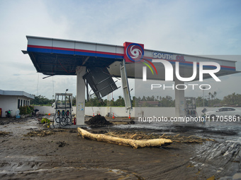 Residents in Lemery, Batangas, were seen cleaning up mud and debris on October 25, 2024, after Tropical Storm Kristine caused severe floodin...