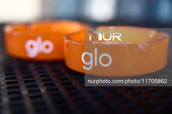 Glo logo is seen on ashtrays in Krakow, Poland on October 25, 2024. 