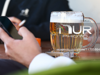 A mug of beer is seen on a table in Krakow, Poland on October 25, 2024. (