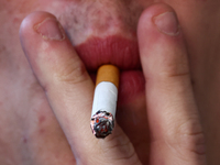 A person smokes a cigarette in Krakow, Poland on October 25, 2024. (