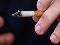 A person smokes a cigarette in Krakow, Poland on October 25, 2024. (