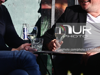 People dirnk a wine in Krakow, Poland on October 25, 2024. (