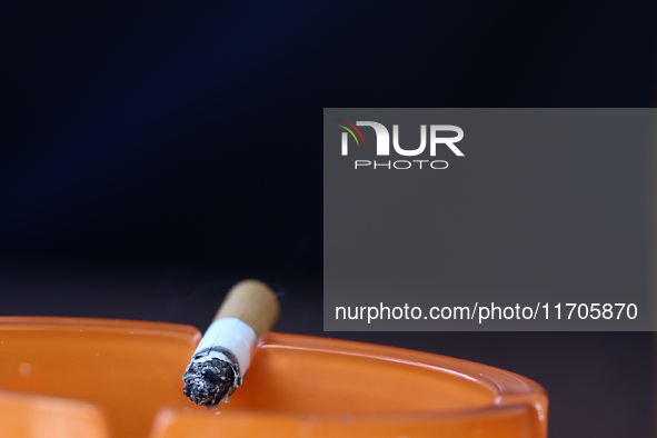 A cigarette is seen in ashtray in Krakow, Poland on October 25, 2024. 