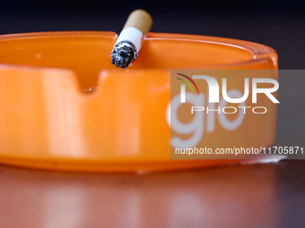 Glo logo is seen on ashtrays in Krakow, Poland on October 25, 2024. (