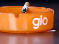 Glo logo is seen on ashtrays in Krakow, Poland on October 25, 2024. (