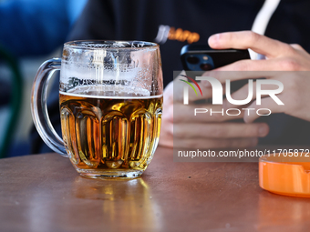 A mug of beer is seen on a table in Krakow, Poland on October 25, 2024. (