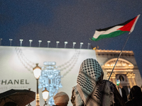 Protesters with flags attend a demonstration in support of Palestinian and Lebanese people as intense Israeli attacks occur in Gaza and Leba...