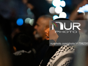 Protesters attend a demonstration in support of Palestinian and Lebanese people as intense Israeli attacks target Gaza and Lebanon, in Paris...