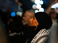 Protesters attend a demonstration in support of Palestinian and Lebanese people as intense Israeli attacks target Gaza and Lebanon, in Paris...