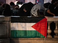 Protesters with flags attend a demonstration in support of Palestinian and Lebanese people as intense Israeli attacks occur in Gaza and Leba...