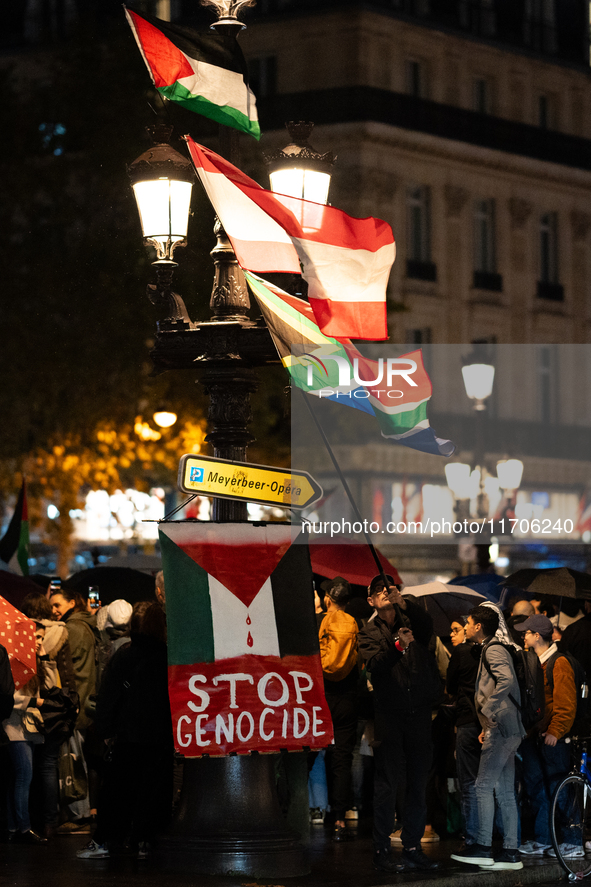 Protesters with flags attend a demonstration in support of Palestinian and Lebanese people as intense Israeli attacks occur in Gaza and Leba...