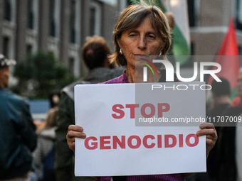 Citizens and activists gather to participate in a rally to support Palestinians in front of the US embassy in Rome, Italy, on October 25, 20...