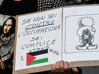 Citizens and activists gather to participate in a rally to support Palestinians in front of the US embassy in Rome, Italy, on October 25, 20...