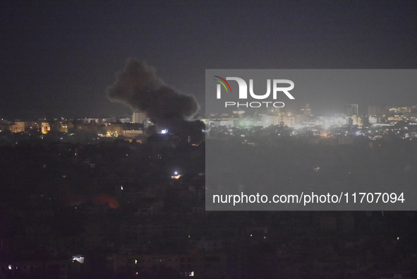 Smoke rises from the site of an Israeli airstrike that targets a neighborhood in Beirut's southern suburbs on October 25, 2024. Israel expan...