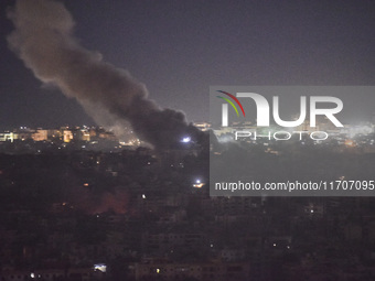 Smoke rises from the site of an Israeli airstrike that targets a neighborhood in Beirut's southern suburbs on October 25, 2024. Israel expan...