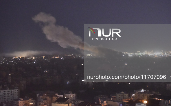 Smoke rises from the site of an Israeli airstrike that targets a neighborhood in Beirut's southern suburbs on October 25, 2024. Israel expan...