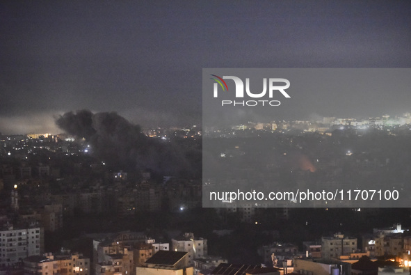 Smoke rises from the site of an Israeli airstrike that targets a neighborhood in Beirut's southern suburbs on October 25, 2024. Israel expan...