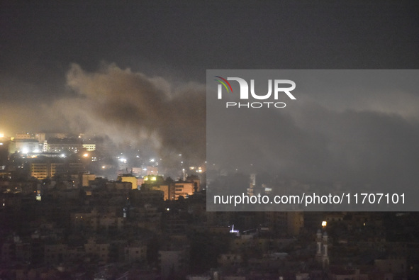 Smoke rises from the site of an Israeli airstrike that targets a neighborhood in Beirut's southern suburbs on October 25, 2024. Israel expan...