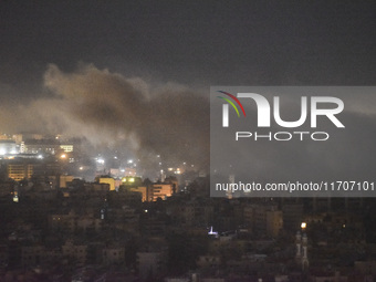 Smoke rises from the site of an Israeli airstrike that targets a neighborhood in Beirut's southern suburbs on October 25, 2024. Israel expan...