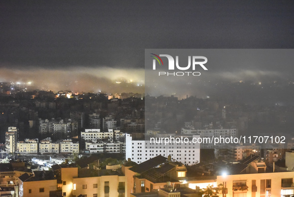 Smoke rises from the site of an Israeli airstrike that targets a neighborhood in Beirut's southern suburbs on October 25, 2024. Israel expan...