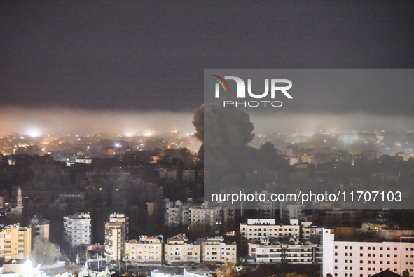 Smoke rises from the site of an Israeli airstrike that targets a neighborhood in Beirut's southern suburbs on October 25, 2024. Israel expan...