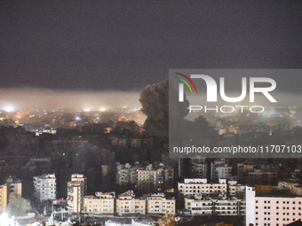 Smoke rises from the site of an Israeli airstrike that targets a neighborhood in Beirut's southern suburbs on October 25, 2024. Israel expan...