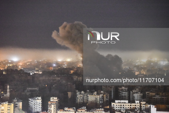 Smoke rises from the site of an Israeli airstrike that targets a neighborhood in Beirut's southern suburbs on October 25, 2024. Israel expan...