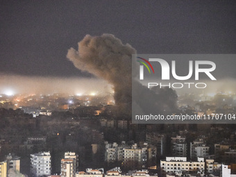 Smoke rises from the site of an Israeli airstrike that targets a neighborhood in Beirut's southern suburbs on October 25, 2024. Israel expan...