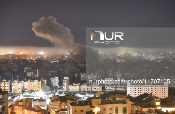 Smoke rises from the site of an Israeli airstrike that targets a neighborhood in Beirut's southern suburbs on October 25, 2024. Israel expan...