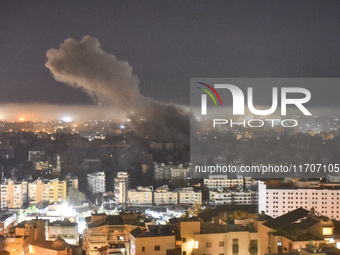 Smoke rises from the site of an Israeli airstrike that targets a neighborhood in Beirut's southern suburbs on October 25, 2024. Israel expan...