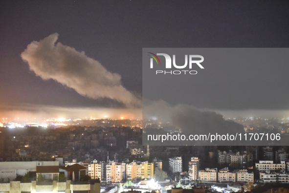 Smoke rises from the site of an Israeli airstrike that targets a neighborhood in Beirut's southern suburbs on October 25, 2024. Israel expan...