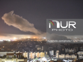 Smoke rises from the site of an Israeli airstrike that targets a neighborhood in Beirut's southern suburbs on October 25, 2024. Israel expan...