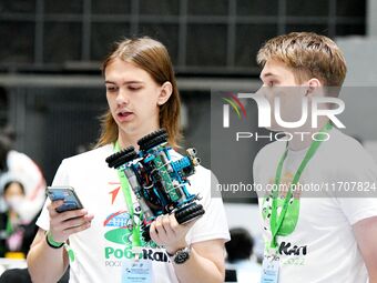 Participants prepare before the Qingdao International RoboCup 2024 in Qingdao, China, on October 26, 2024. (