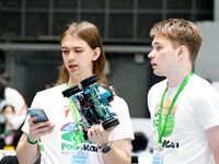 Participants prepare before the Qingdao International RoboCup 2024 in Qingdao, China, on October 26, 2024. (