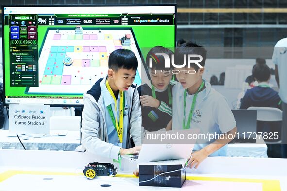 Participants prepare before the Qingdao International RoboCup 2024 in Qingdao, China, on October 26, 2024. 