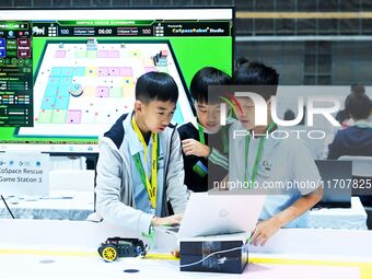 Participants prepare before the Qingdao International RoboCup 2024 in Qingdao, China, on October 26, 2024. (