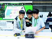 Participants prepare before the Qingdao International RoboCup 2024 in Qingdao, China, on October 26, 2024. (