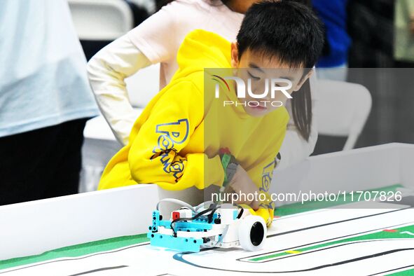 Participants prepare before the Qingdao International RoboCup 2024 in Qingdao, China, on October 26, 2024. 