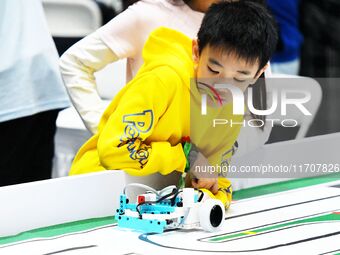 Participants prepare before the Qingdao International RoboCup 2024 in Qingdao, China, on October 26, 2024. (