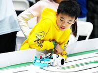 Participants prepare before the Qingdao International RoboCup 2024 in Qingdao, China, on October 26, 2024. (