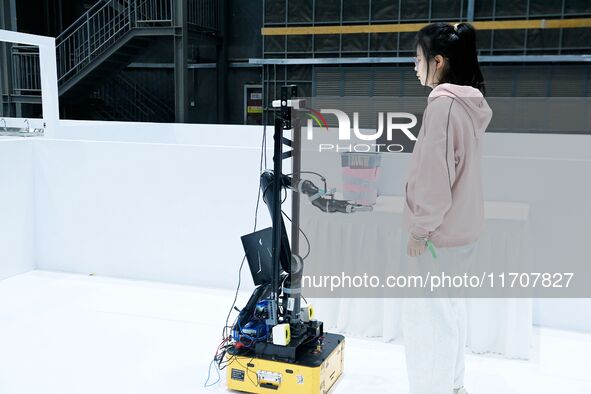 Participants prepare before the Qingdao International RoboCup 2024 in Qingdao, China, on October 26, 2024. 