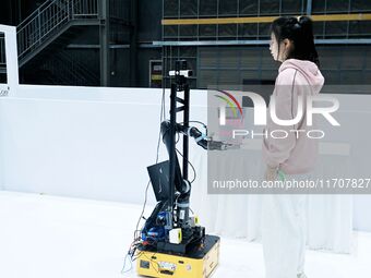 Participants prepare before the Qingdao International RoboCup 2024 in Qingdao, China, on October 26, 2024. (