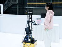 Participants prepare before the Qingdao International RoboCup 2024 in Qingdao, China, on October 26, 2024. (